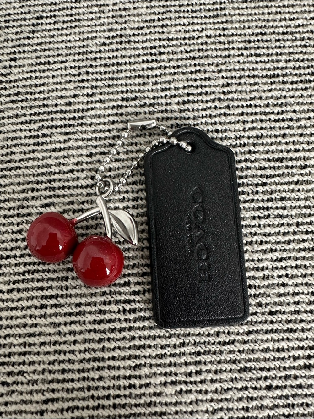 Coach leather hang tag with cherry bag charm large